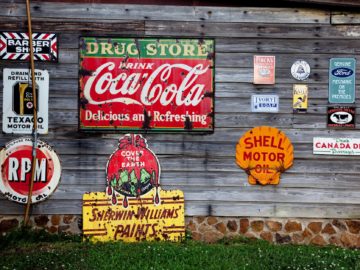 drug store drink coca cola signage on gray wooden wall