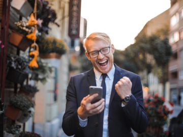 man in black suit jacket received a good news